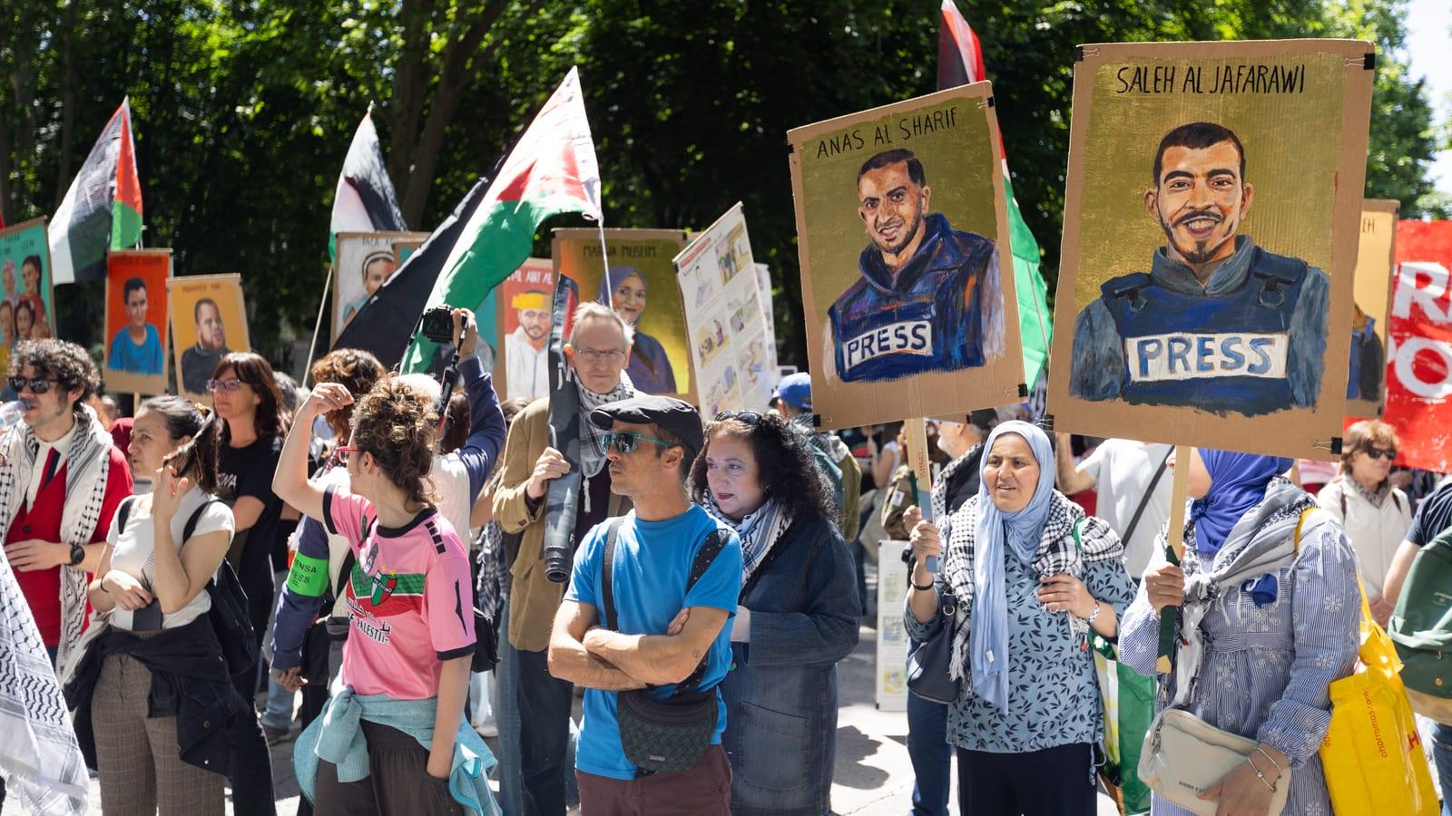 Demonstrators carrying portraits of the Gaza journalists Anas al-Sharif, Khaled El-Shawa and Saleh al-Jafarawi, Madrid, May 2026