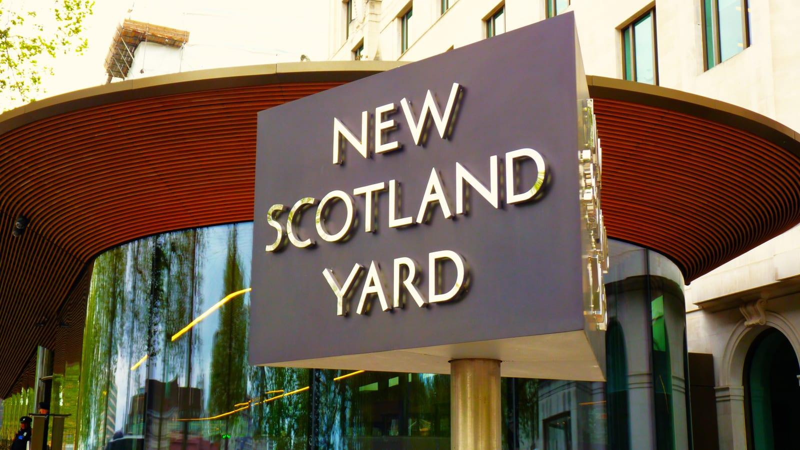 The rotating sign outside New Scotland Yard, London