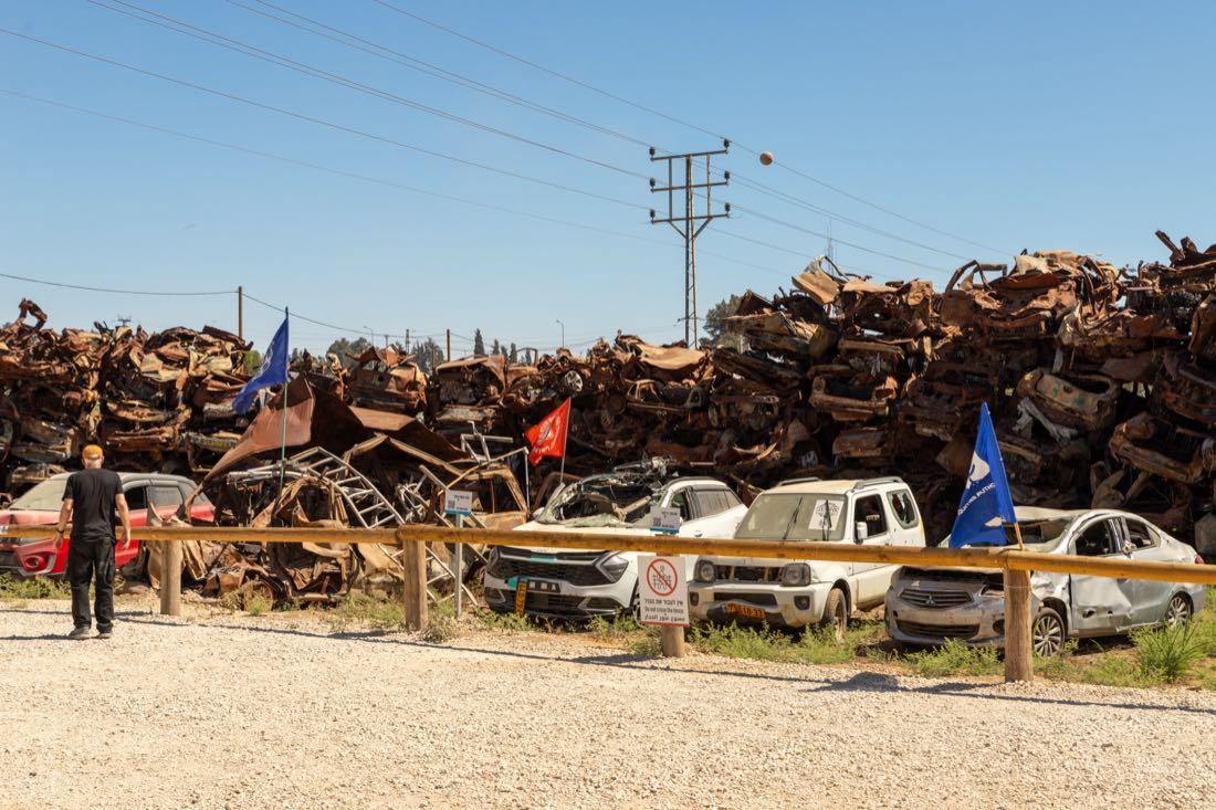 Hundreds of burnt and bullet-riddled cars stacked at the collection site near Tkuma, in southern Israel