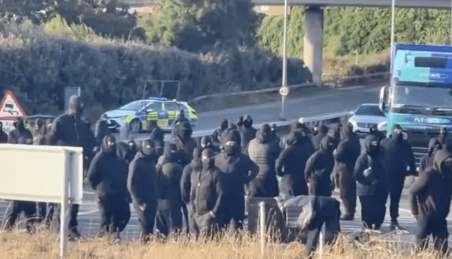 Masked Protesters Block A20 Traffic Into And Out Of Port Of Dover In Kent