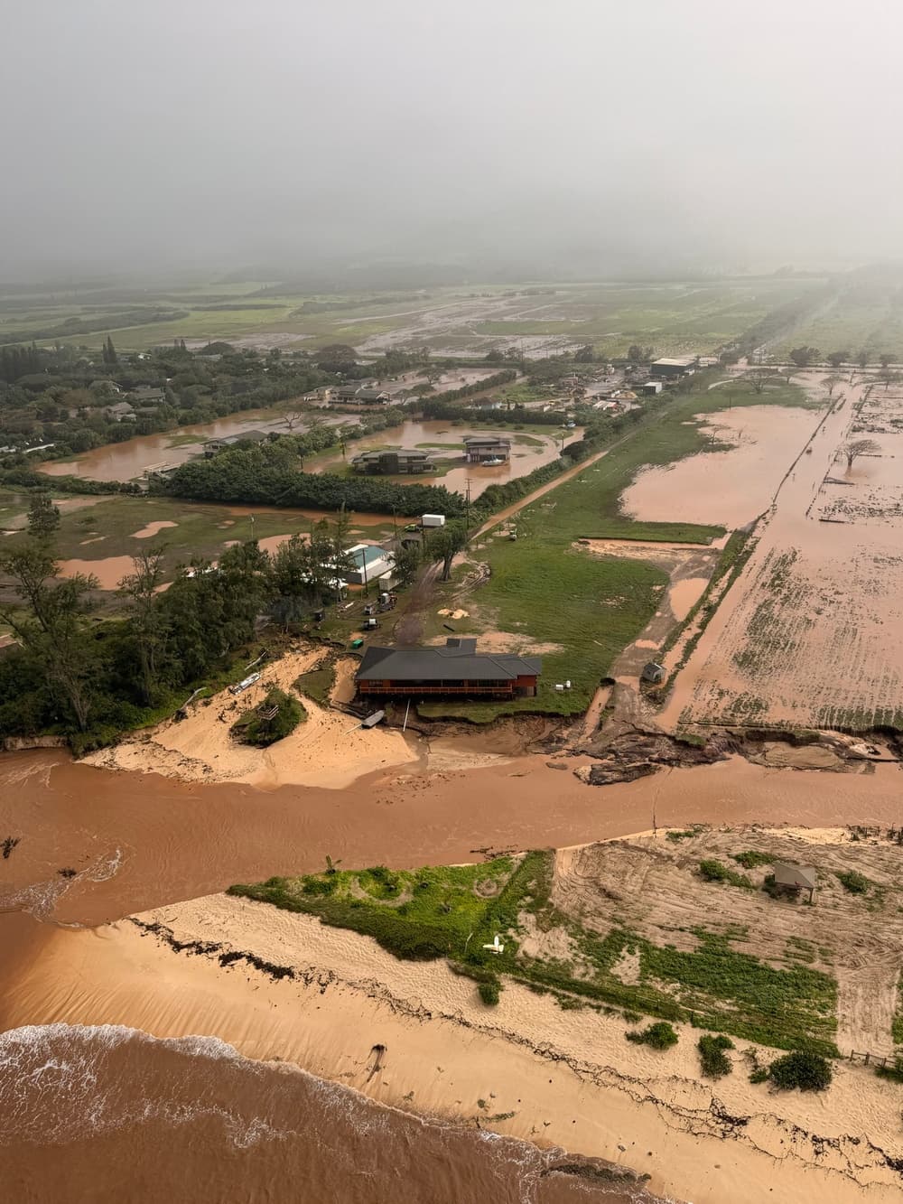 Coast Guard and Navy Aircrews Rescue Seven People and a Dog From Oahu Floods