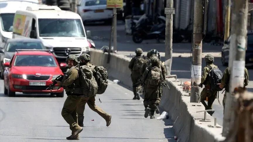 Israeli Forces And Settlers Raid West Bank, Sparking Confrontations In Nablus And Hebron