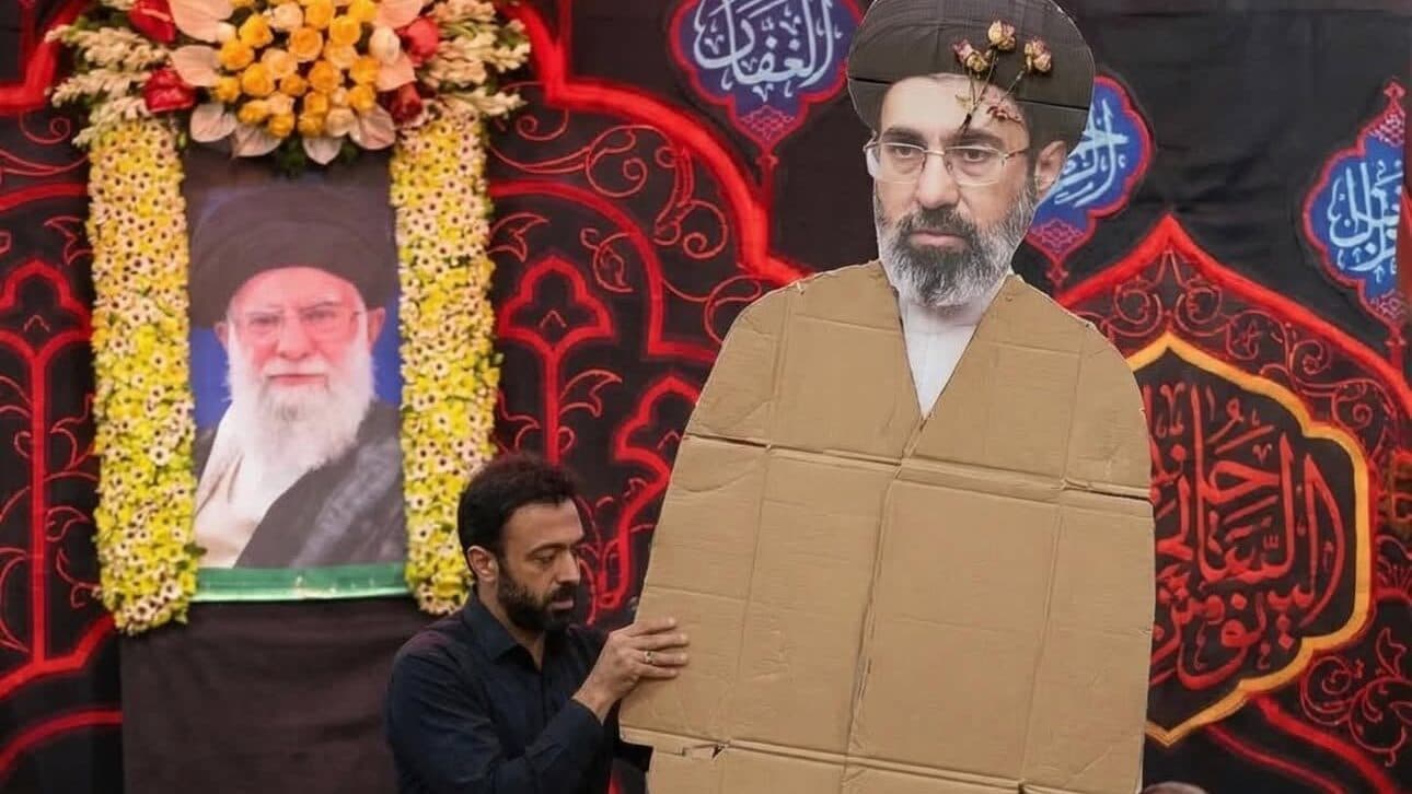 Social Media Spreads Fake Video Showing President Donald Trump Revealing Cardboard Ayatollah Mojtaba Khamenei