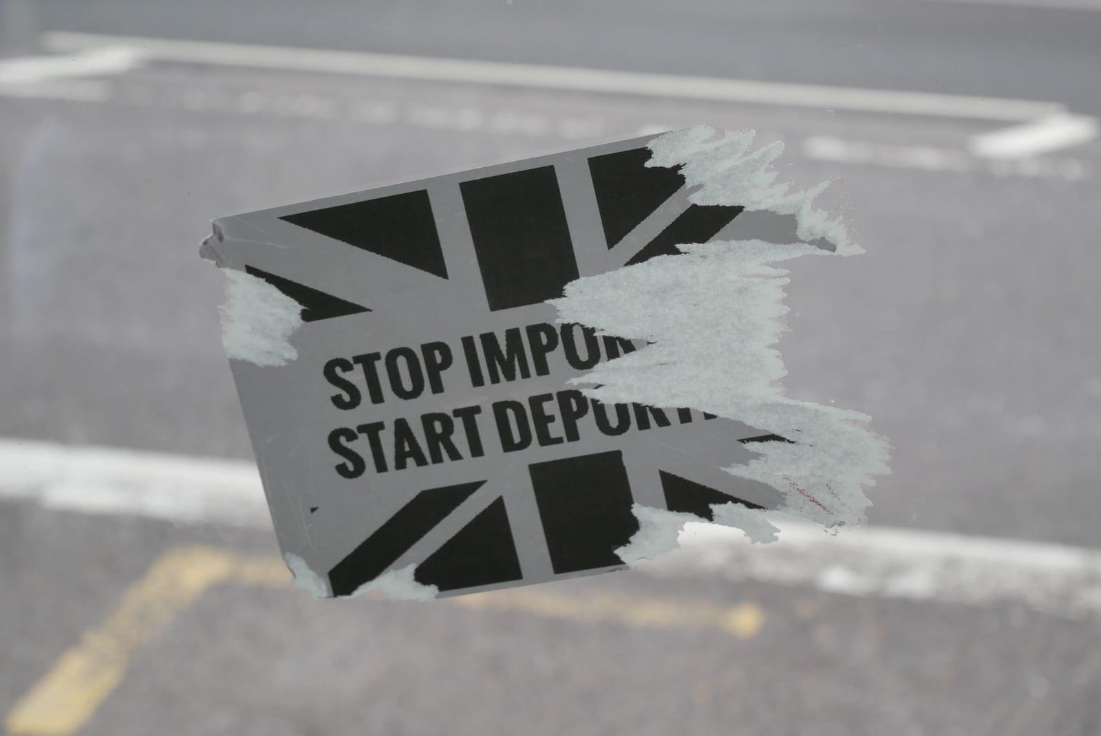 Flags and placards left behind after the Unite the Kingdom rally, London, September 2025