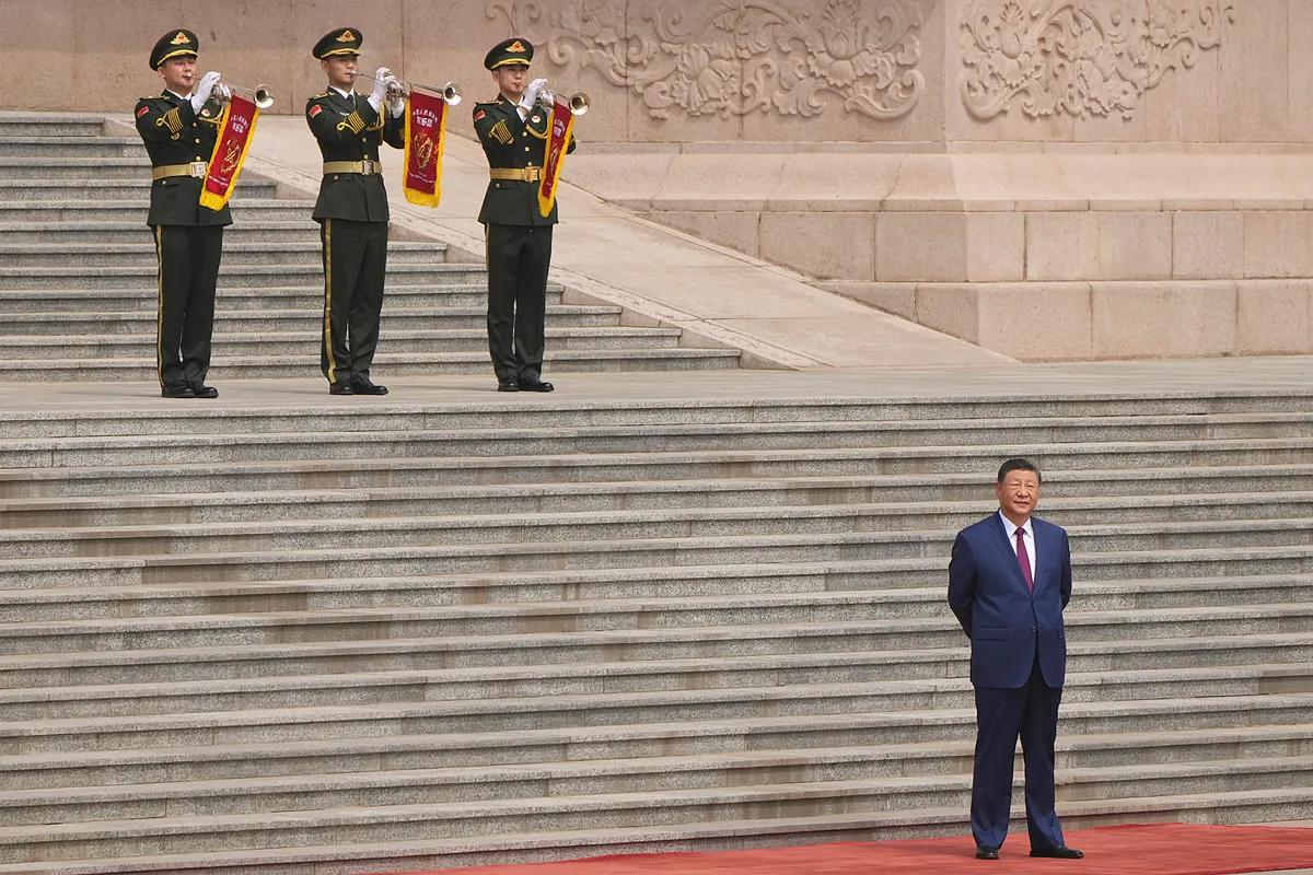 Xi Jinping Defends New Silk Roads In Paris As China Detains A US Citizen