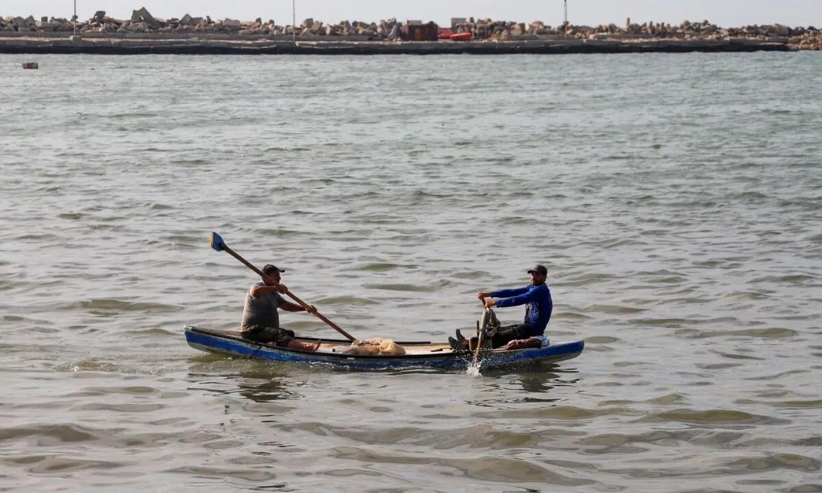 Gaza fishermen recycle the rubble from destroyed houses to repair their boats.