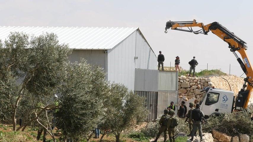 Israel demolishes wall of house and part of car showroom near Jenin.