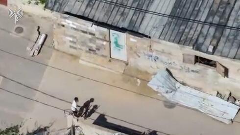 IDF Releases Footage Of Gaza Terrorist Using Child To Transfer Weapons Into Civilian Home