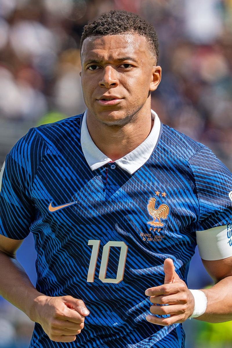 close-up of footballer in blue national team jersey on pitch