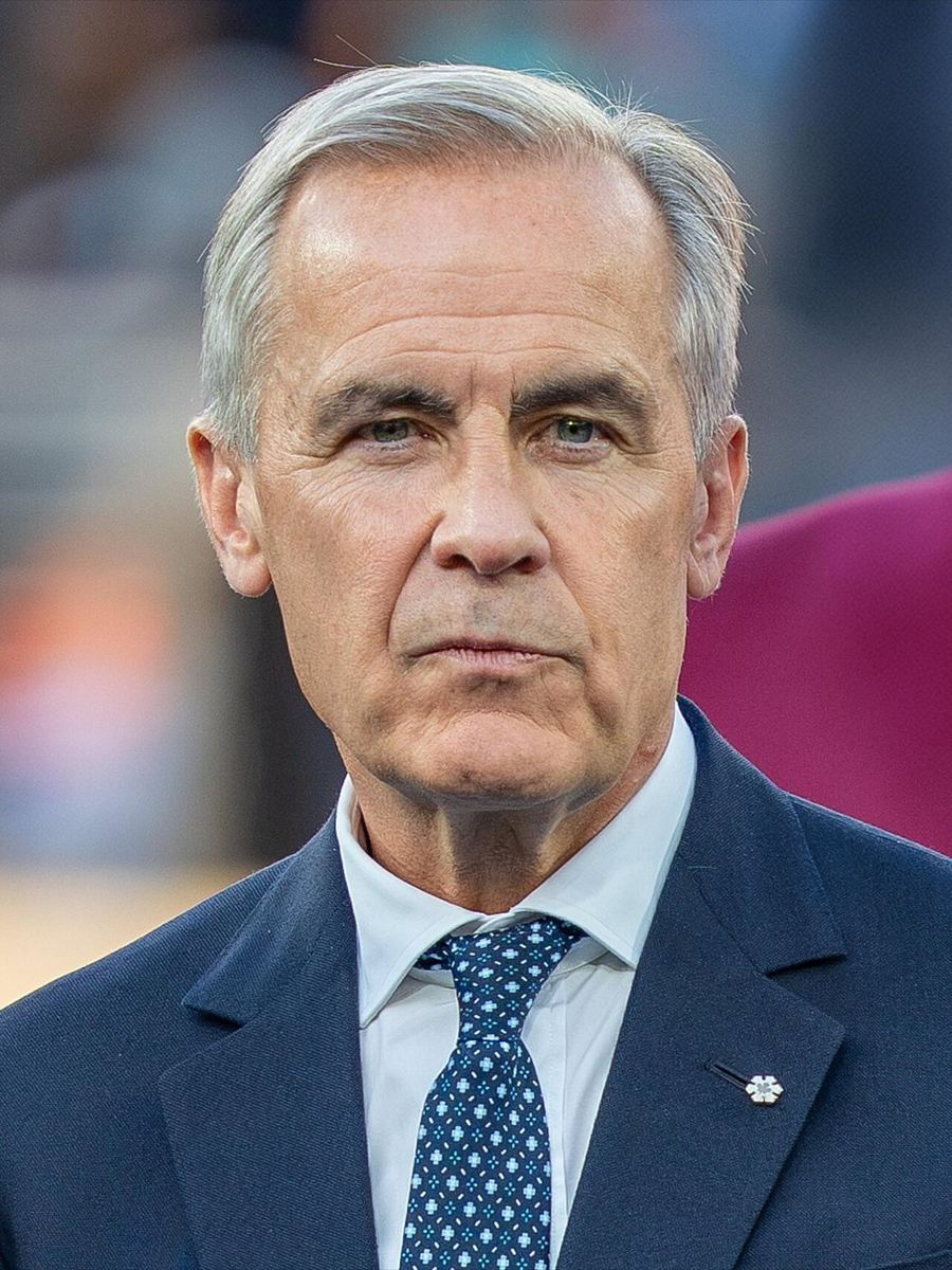 Close-up portrait of a middle-aged man in a suit and patterned tie