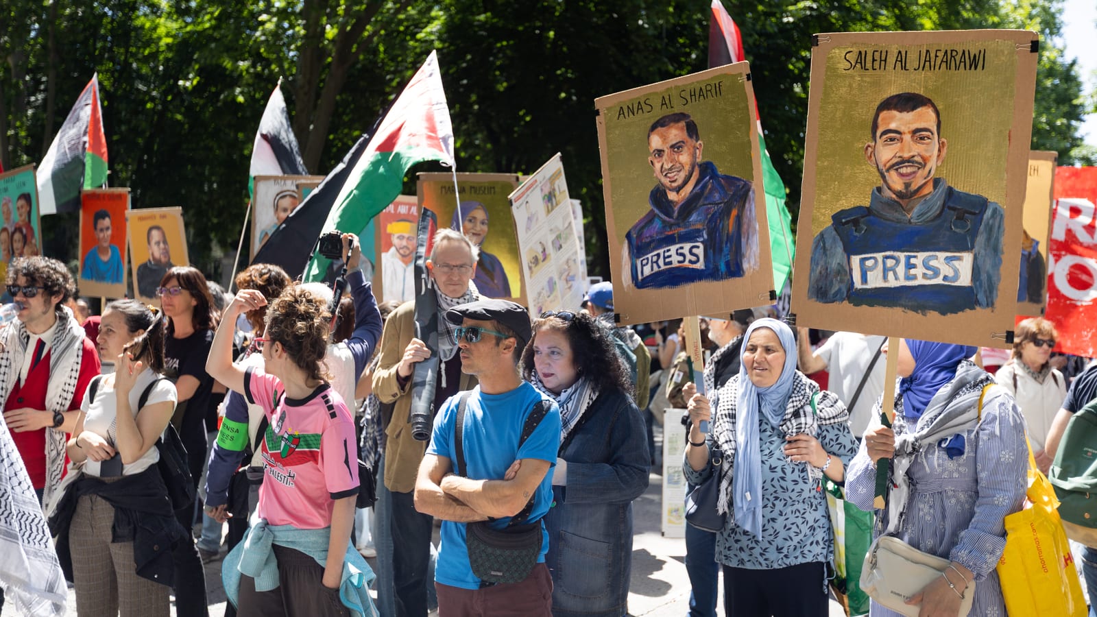 Demonstrators carrying portraits of the Gaza journalists Anas al-Sharif, Khaled El-Shawa and Saleh al-Jafarawi, Madrid, May 2026